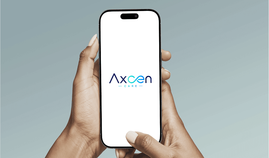 Hands holding a smartphone displaying the AXCEN Care app logo